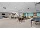Condo recreation area has a bar seating area, tables for games, and a lounge to socialize in at 2 Adams St # 806, Denver, CO 80206
