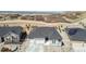 Stunning aerial view of the home, showcasing its prime location near a field and a mountain range at 1581 Diamond Hill Ct, Castle Rock, CO 80104