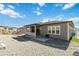 Back exterior of home with covered patio and view of fenced backyard at 1581 Diamond Hill Ct, Castle Rock, CO 80104
