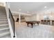 Expansive finished basement with a pool table, bar area, and ample space for entertainment at 1581 Diamond Hill Ct, Castle Rock, CO 80104