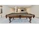 Basement area showcasing a pool table, stairs with metal railing, and access to the TV area at 1581 Diamond Hill Ct, Castle Rock, CO 80104