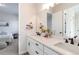 Bathroom showcasing double sinks, modern fixtures, and a view into an adjacent bedroom at 1581 Diamond Hill Ct, Castle Rock, CO 80104
