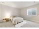 Cozy bedroom with neutral walls, carpet, a comfortable bed, and a window that brings in natural light at 1581 Diamond Hill Ct, Castle Rock, CO 80104