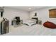 A stylish bedroom featuring a desk, chair, bed, and a relaxing beanbag, with neutral colors and carpet at 1581 Diamond Hill Ct, Castle Rock, CO 80104