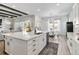 Open-concept kitchen with a large island, stylish countertops, stainless appliances and adjacent dining area at 1581 Diamond Hill Ct, Castle Rock, CO 80104
