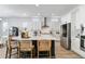 Eat-in kitchen features a large island, stainless appliances, and stylish seating at 1581 Diamond Hill Ct, Castle Rock, CO 80104