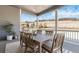 Inviting covered patio with a wooden dining set, perfect for outdoor meals and enjoying the serene landscape at 1581 Diamond Hill Ct, Castle Rock, CO 80104
