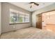 Cozy bedroom with a large window providing ample natural light and an adjacent room at 23738 E Clifton Pl, Aurora, CO 80016
