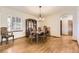 Formal dining room with hardwood floors, elegant chandelier, and natural light at 23738 E Clifton Pl, Aurora, CO 80016