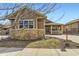 Inviting home exterior featuring stone accents, a covered porch, and well-maintained landscaping at 23738 E Clifton Pl, Aurora, CO 80016