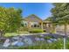 Charming home exterior showcasing well-maintained landscaping, stone accents, and a cozy front porch at 23738 E Clifton Pl, Aurora, CO 80016