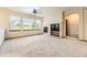 Comfortable living room with a fireplace, large windows, and neutral tones, ideal for relaxing at 23738 E Clifton Pl, Aurora, CO 80016