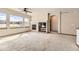Spacious living room with a fireplace, built-in media center, and lots of natural light at 23738 E Clifton Pl, Aurora, CO 80016