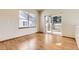 Bright living room with hardwood floors, sliding glass doors to the deck and natural light at 23738 E Clifton Pl, Aurora, CO 80016