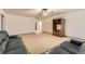 Large living room with plush carpeting, a ceiling fan, and built-in shelves for entertainment at 23738 E Clifton Pl, Aurora, CO 80016