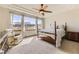 Spacious main bedroom with a ceiling fan, large window, and comfortable seating area at 23738 E Clifton Pl, Aurora, CO 80016