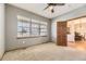 Comfortable office space with a large window and ceiling fan, ideal for remote work or study at 23738 E Clifton Pl, Aurora, CO 80016