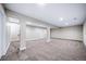 Large basement area with carpet, recessed lighting and visible support beams at 4064 S Olathe Ct, Aurora, CO 80013