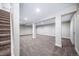 Open basement area with neutral colored walls and carpet, ideal for customization at 4064 S Olathe Ct, Aurora, CO 80013