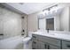 Modern bathroom showcasing stylish vanity, a marble-tiled shower, and sleek fixtures at 4064 S Olathe Ct, Aurora, CO 80013