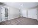 Bedroom featuring neutral carpeting and access to the bathroom and closet at 4064 S Olathe Ct, Aurora, CO 80013