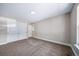 Spacious bedroom featuring carpeted floors and a closet with stylish sliding doors at 4064 S Olathe Ct, Aurora, CO 80013