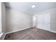 Bedroom featuring neutral carpeting, closet with sliding doors, and access to hallway at 4064 S Olathe Ct, Aurora, CO 80013