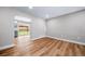Bright dining area featuring updated flooring and sliding door access to the backyard at 4064 S Olathe Ct, Aurora, CO 80013