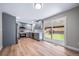 Modern kitchen with stainless steel appliances, gray cabinetry, and a view of the backyard at 4064 S Olathe Ct, Aurora, CO 80013