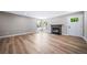 Inviting living room featuring a modern fireplace and updated flooring at 4064 S Olathe Ct, Aurora, CO 80013