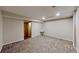 Spacious basement area with a sink and doorway to other spaces at 1050 S Monaco Pkwy # 38, Denver, CO 80224