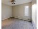 Cozy bedroom featuring a large window and ceiling fan at 1050 S Monaco Pkwy # 38, Denver, CO 80224