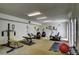 Carpeted exercise room featuring various machines, bench, and weights at 1050 S Monaco Pkwy # 38, Denver, CO 80224