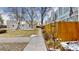 Exterior view of a residential building with a landscaped yard and pathway at 1050 S Monaco Pkwy # 38, Denver, CO 80224