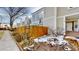 Charming townhome with a fenced front yard and landscaped entrance at 1050 S Monaco Pkwy # 38, Denver, CO 80224