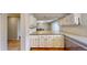 Kitchen offers granite countertops, bright white cabinets, and easy access to dining area at 1050 S Monaco Pkwy # 38, Denver, CO 80224