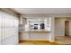 Open kitchen area with stainless appliances, granite countertops, and a breakfast bar at 1050 S Monaco Pkwy # 38, Denver, CO 80224