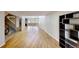 Open-concept living room features hardwood flooring, a staircase, and lots of natural light at 1050 S Monaco Pkwy # 38, Denver, CO 80224