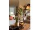 Cozy living room featuring comfortable seating, decor, and modern shelving at 1050 S Monaco Pkwy # 38, Denver, CO 80224