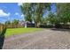 Large backyard with a well maintained lawn, wooden fence, big trees, and parking spaces for RV or Boat at 8801 E 16 Ave, Denver, CO 80220