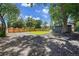 Large backyard with wooden fence, big trees, and several RV or Boat parking spots at 8801 E 16 Ave, Denver, CO 80220