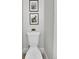 Bright bathroom showcasing a toilet, neutral paint, and tiled floors at 8801 E 16 Ave, Denver, CO 80220