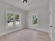 Bright bedroom featuring hardwood flooring and ample natural light at 8801 E 16 Ave, Denver, CO 80220