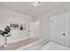 Neutral bedroom featuring modern art and hardwood floors at 8801 E 16 Ave, Denver, CO 80220