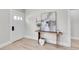 Bright entryway with modern door and wooden table and decor at 8801 E 16 Ave, Denver, CO 80220