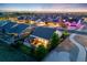This aerial view showcases the backyard's layout with its patio, pergola, and lush landscaping at 19688 E 52Nd Ave, Denver, CO 80249