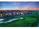 Gorgeous aerial view shows the property's location and its proximity to neighborhood amenities and the golf course at 19688 E 52Nd Ave, Denver, CO 80249