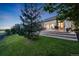 The backyard features an expansive patio space, perfect for entertaining or enjoying a quiet evening at 19688 E 52Nd Ave, Denver, CO 80249