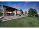 This home features a stunning backyard with a spacious patio and inviting pergola, perfect for outdoor entertaining at 19688 E 52Nd Ave, Denver, CO 80249