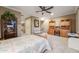 Spacious bedroom with a cozy bed, complemented by warm lighting, and ample storage, creating a relaxing retreat at 19688 E 52Nd Ave, Denver, CO 80249
